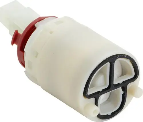 Kartusche von Ideal Standard, mit einem Anschluss für Wasserleitungen, erkennbar an der Struktur und den seitlichen Verbindungen im Inneren.